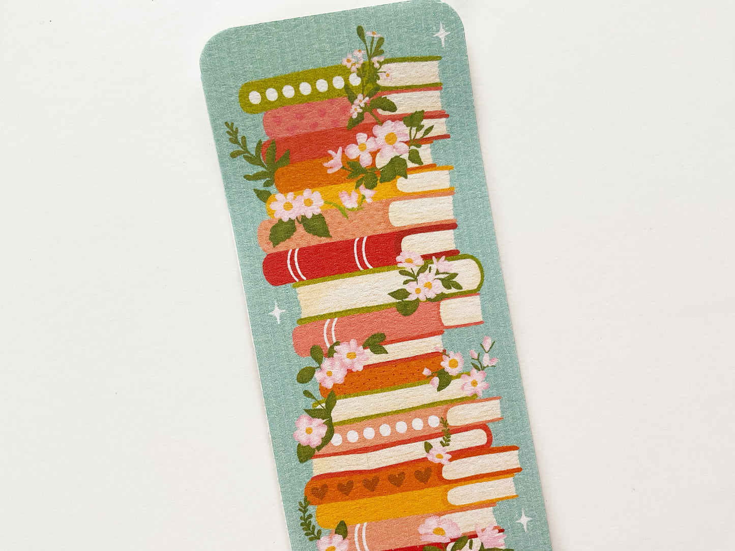 Bookstack with Florals Bookmark – Elegant Literary Design