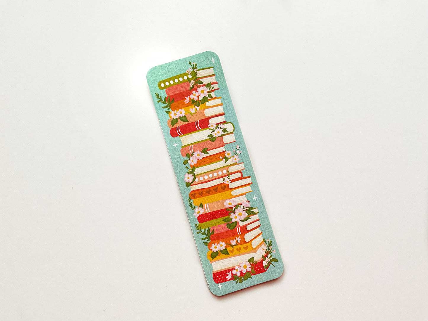 Bookstack with Florals Bookmark – Elegant Literary Design