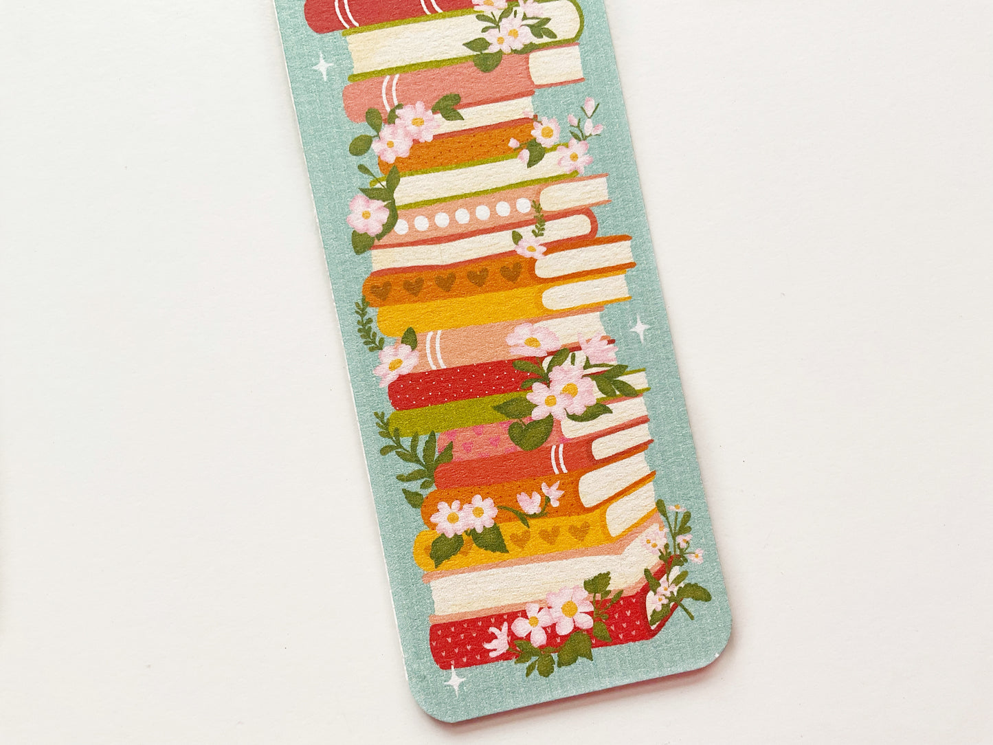 Bookstack with Florals Bookmark – Elegant Literary Design