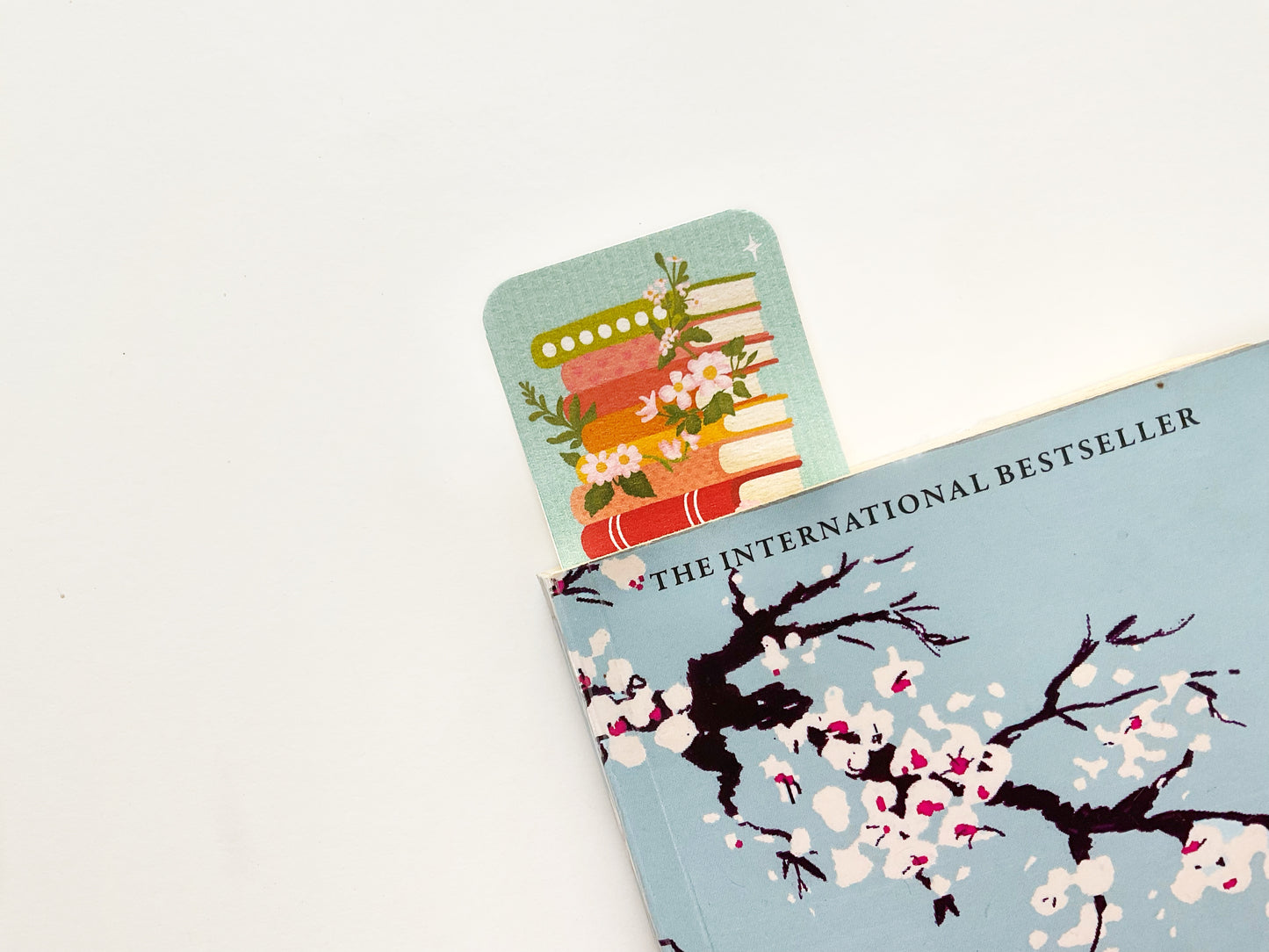 Bookstack with Florals Bookmark – Elegant Literary Design